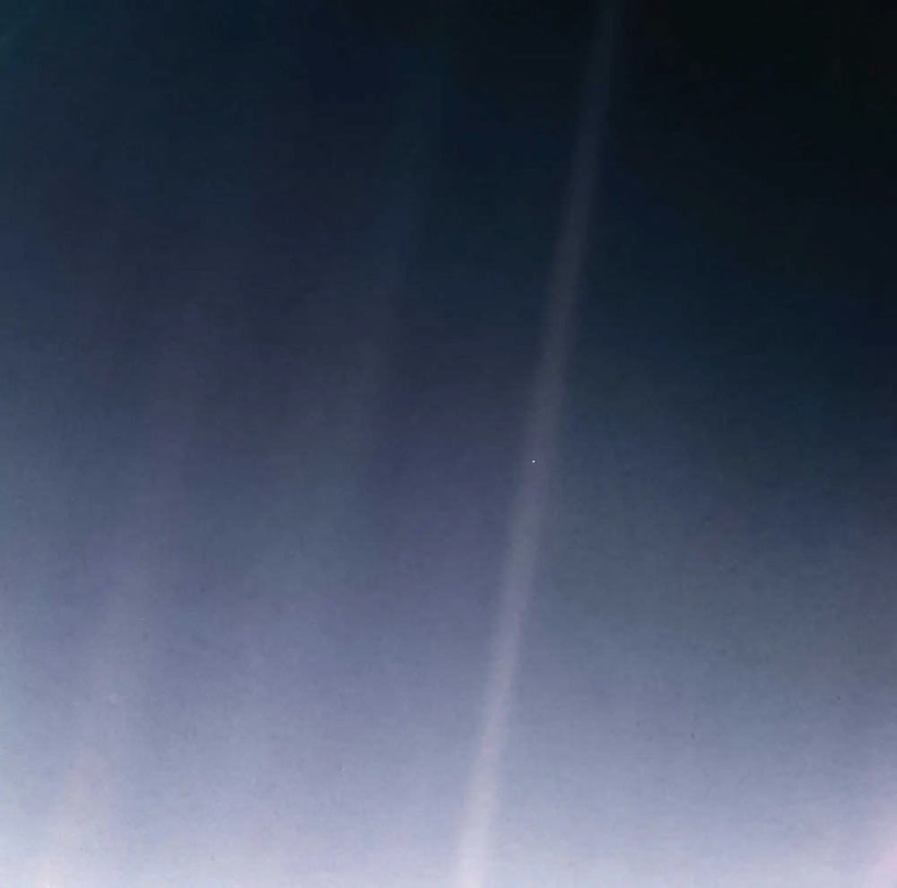 The Earth, photographed from nearly six billion kilometres away, appears as only a pale blue dot [NASA]